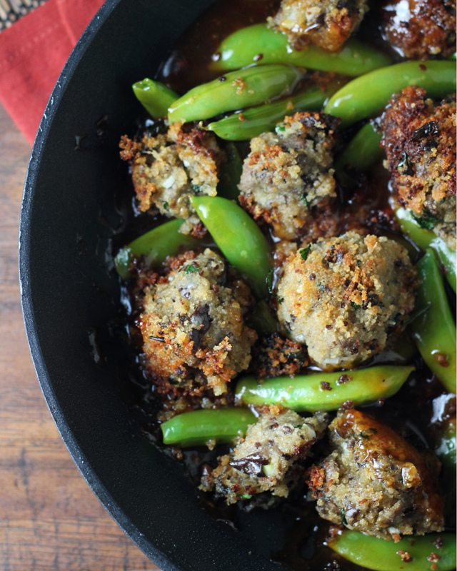 eggplant meatballs and sugar snap peas in a sesame ginger sauce