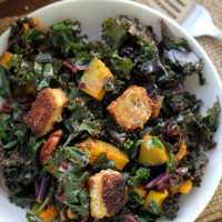 kale salad with brie croutons, roasted butternut squash, cumin-spiced pecans and a cranberry vinaigrette