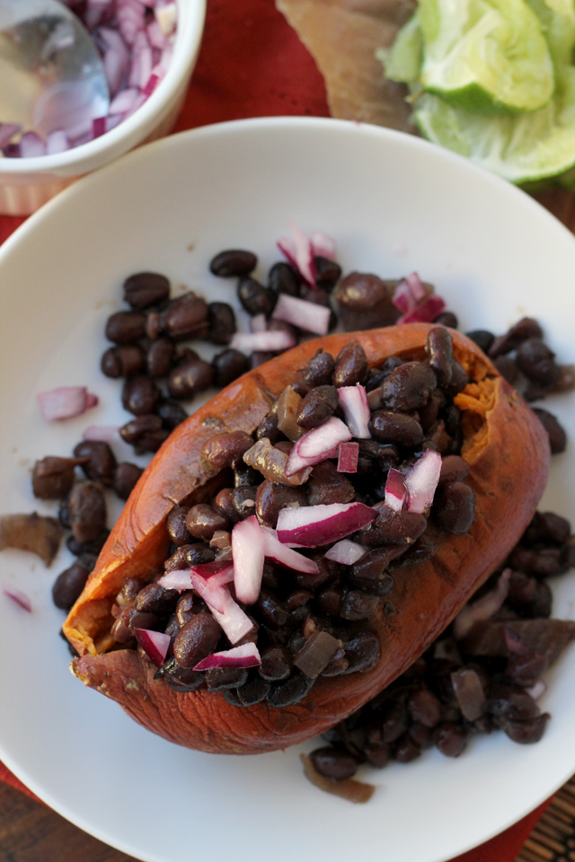 slow cooker black bean ragout on roasted sweet potatoes