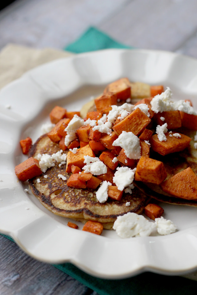 savory chickpea pancakes with spicy roasted carrots, sweet potatoes, and feta