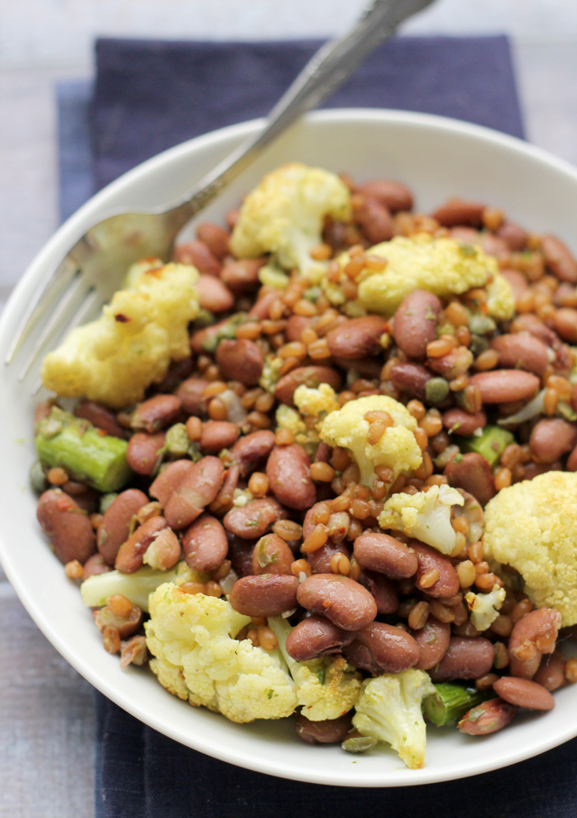 roasted cauliflower, asparagus, and wheat berry bowl with caper vinaigrette