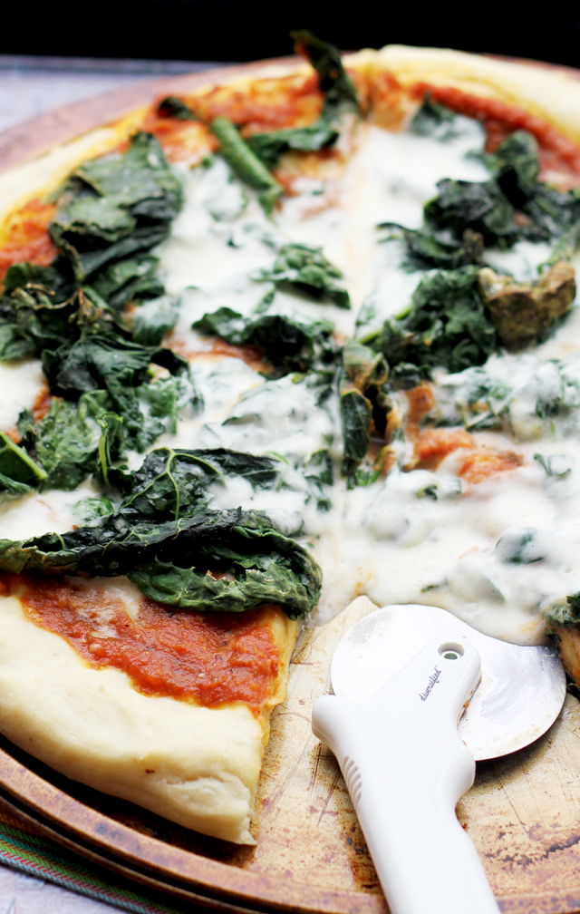 pumpkin-chipotle pizza with kale and burrata