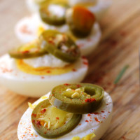 homemade quick-pickled jalapenos on hard boiled eggs