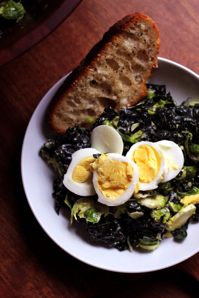 kale and brussels sprout Caesar salad with parmesan toasts