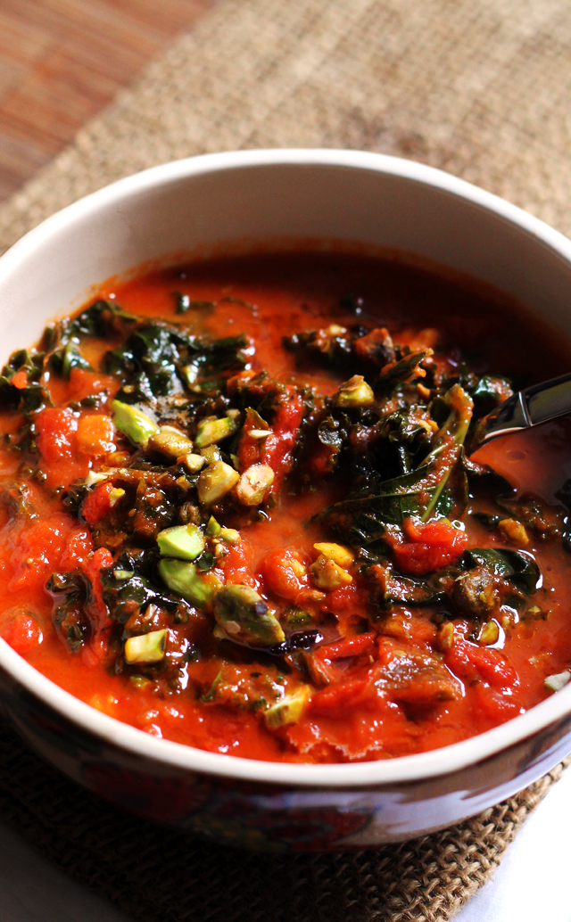 tomato soup with brown butter, kale, and pistachios