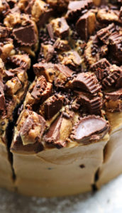 Decadent Triple Layer Dark Chocolate Cake with Whipped Peanut Butter Frosting