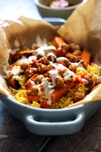 Halal Street Cart Chickpeas with Turmeric Rice, Tahini Yogurt Sauce, and Harissa Oil