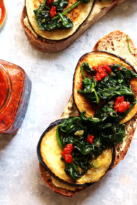 Roasted Eggplant and Hummus Tartines with Harissa and Garlicky Spinach