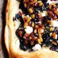Swiss Chard and Goat Cheese Tart with a Currant-Pine Nut Relish