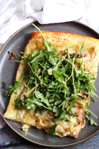 Cheesy Onion Tart with Arugula, Pecorino, and Walnut Salad
