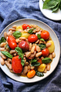 White Bean and Roasted Cherry Tomato Salad with Basil, Chili, and Capers