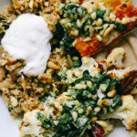 Roasted Cauliflower and Halloumi Bowls with Dates and Freekeh Pilaf
