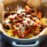 Halal Street Cart Chickpeas with Turmeric Rice, Tahini Yogurt Sauce, and Harissa Oil