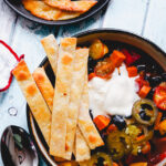Saucy Sweet Potato, Roasted Tomato, and Black Bean Tortilla Bowls